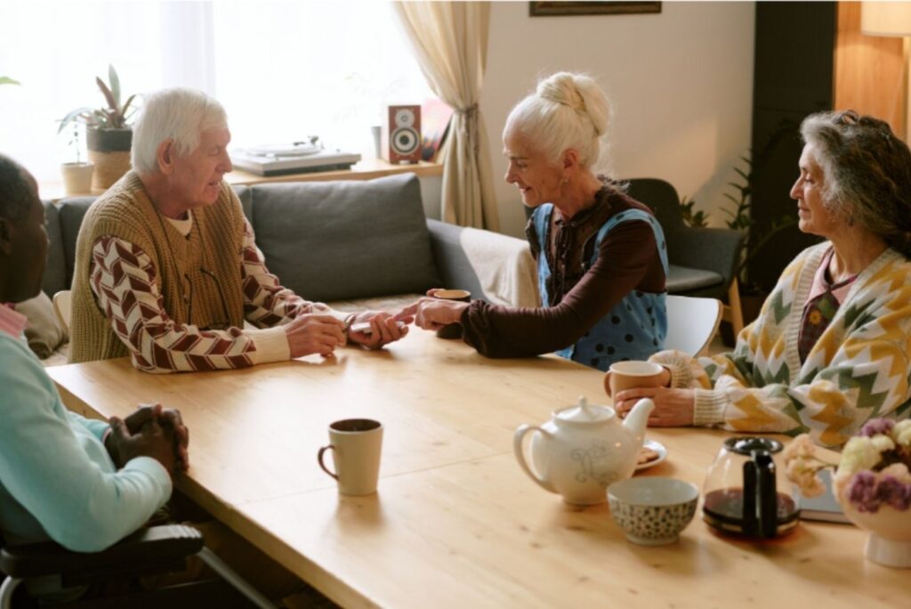 Elderly people around table